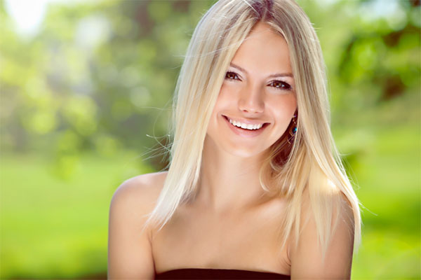 Woman outside, smiling