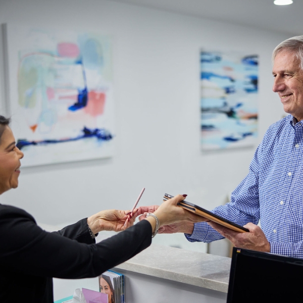 Interaction between front desk and patient