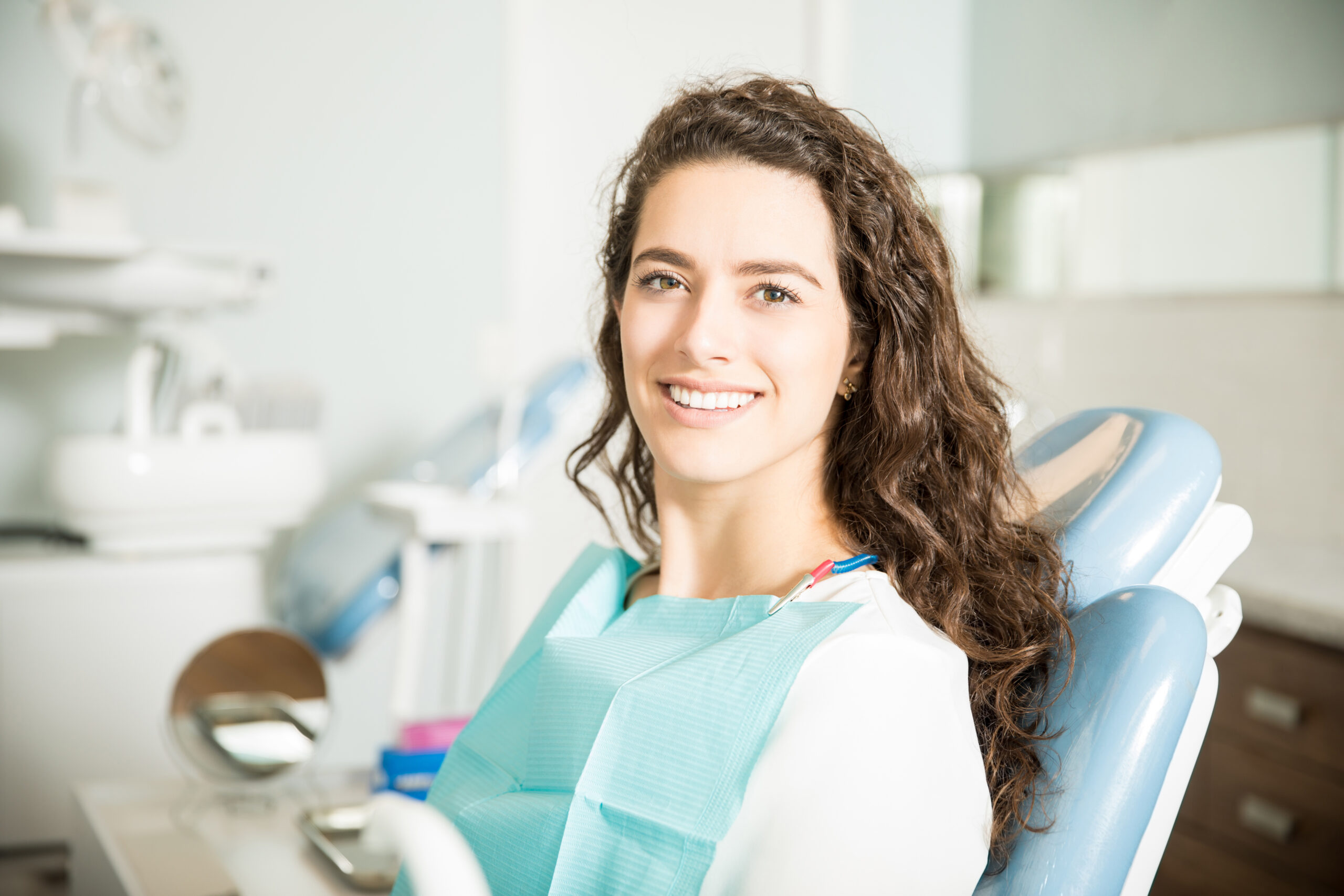 Smiling woman in dentist chair